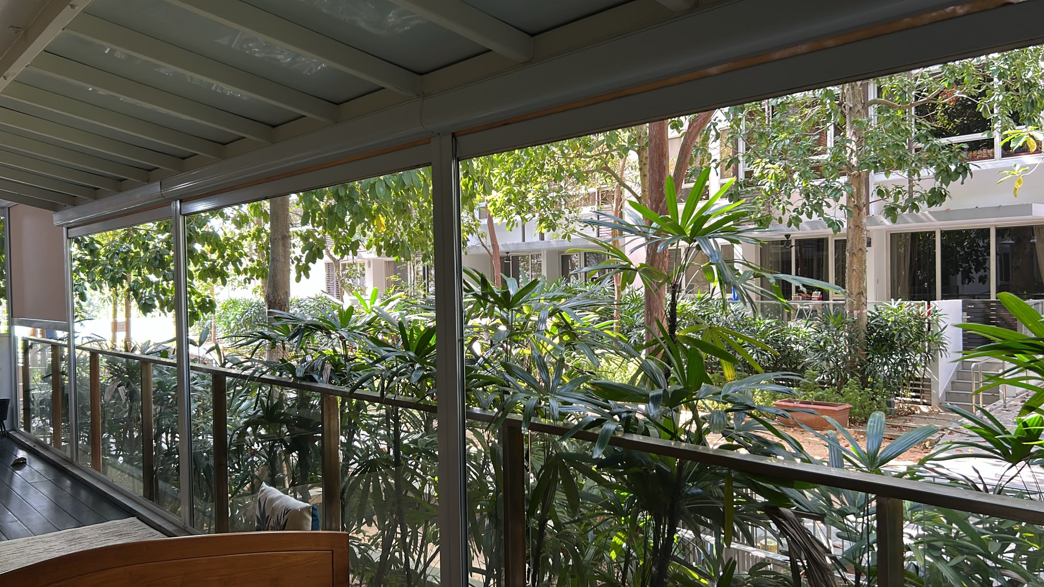 Covered private patio with leafy outlook